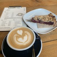 Flat white and cherry pie  at Goosebumps Coffee Lab in Budapest