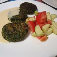 Spinach pâtés with salad and sauce at Dream House in Sofia