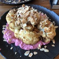 The cauliflower dish, which consisted of beetroot hummus, tahini, the roasted cauliflower, and sliced almonds  at Chilai in Vienna