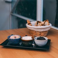 Couvert (pão c/ patê caseiro de azeitonas, pasta de "Atum" e manteiga de alho confitado) at A Minha Avó in Lisbon