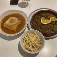 Francesinha and "duck" dish  at A Minha Avó in Lisbon