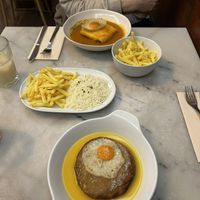 Francesinha vegana and seitan steak with ,,egg" at A Minha Avó in Lisbon