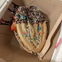 Eve waffle with dark chocolate, strawberry and colorful sprinkles at Adam & Eve Waffles in Berlin