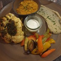 Cauliflower smoky grilled, curry couscous, baba ganoush, mint yoghurt, grilles veggies at Hornox in Zermatt