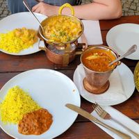 Vegetarian Korma, Dal Makhani, Jeera Rice and some type of Indian bread filled with potatoes, cheese and garlic. at Taj Mahal  in Decin