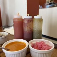House sauces, vegan spicy cashew and pickled onions  at 3 in 1 Restaurant in Indianapolis