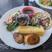 Vegan tamale and pupusa platter at La Macarena in New Orleans