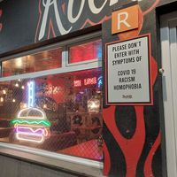 Anti racist and homophobic sign at the door at Rockabilly in Gran Canaria