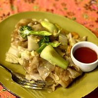 Pad Se Ew (Stir Fried Thick Noodles) asked to be made vegan - often pay the extra & to add tofu, this is a favourite! Not spicy unless you add the tasty chilli sauce 👌🏼  at Songkran Thai Restaurant in Cairns