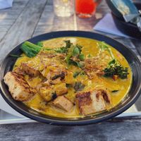 Curry on mushroom grits. This is my preference but the tofu was soft and I don’t like that. You honestly didn’t need the tofu it was a hit without it   at Cinder Restaurant in Westerly