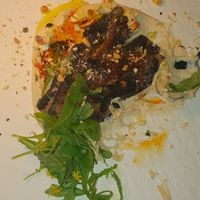 Hummus con berenjena de maracuyá at MUDRA Plant Based  in Madrid