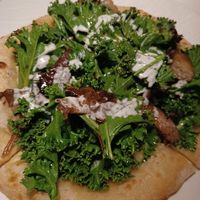 Pizza trufada de kale at MUDRA Plant Based  in Madrid