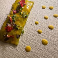 Spinach canneloni with Tikka Masala spiced filling - NO MAIN DISH SHOULD BE 3 BITES! at MUDRA Plant Based  in Madrid