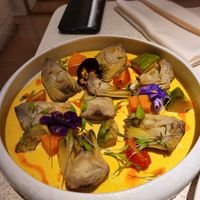 Artichoke with cream and paprika oil - was the best! at MUDRA Plant Based  in Madrid