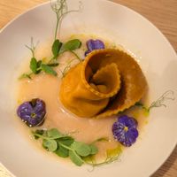 Almond ricotta pasta, dried filling at MUDRA Plant Based  in Madrid