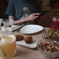 First cocktails with croquettes, olives and spicy nuts. at Amberes The Vegetarian Wine And Cocktail Bar in Valencia