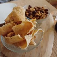 Casava chips and roasted nuts at Amberes The Vegetarian Wine And Cocktail Bar in Valencia