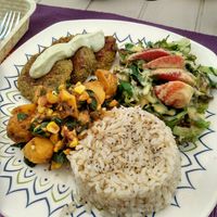 Whole grain rice, leeks with corn tofu and potato, garbanzo patties with sesame seeds, spinach lettuce and strawberry salad at Las Veganas in Medellin