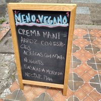 Daily menu on chalkboard outside at Las Veganas in Medellin