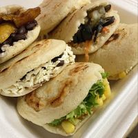 Arepas Filled with veggie toppings at Aceittuna Express in Santiago