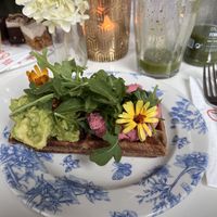 Savory waffle with hummus & avocado   at Oslo Raw Frogner in Oslo