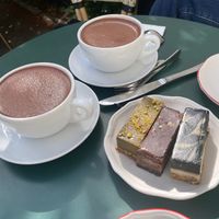 Hot chocolate and raw cake (pistachio, peanut and liquorice) at Oslo Raw Frogner in Oslo