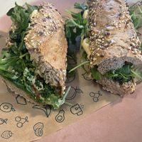 Mediterranean vegan baguette with hummus and salad  at Green&Berry Corner in Barcelona