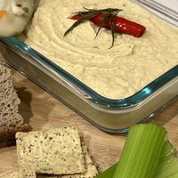 Extra spicy pickle hummus from scratch, Jalapeño pulp chips, and buckwheat bread  at Ethikli in Long Beach