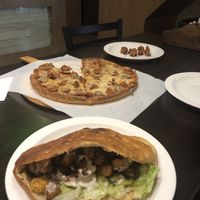 L-R. Super pitta, meat feast pizza and chicken skewers.  at Veggie Lounge in Wolverhampton