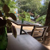 Table with view on the marina and lake  at Baraka in Bacalar
