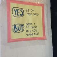 Service fee and minimum charge for credit cards at Cinnamon Works in Seattle