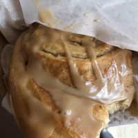 Vegan cinnamon roll with maple frosting  at Cinnamon Works in Seattle