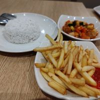 sweet and sour chicken rice with fries at Nyonya Vege in Kuala Lumpur