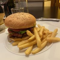 vegan burger that comes with fries  at La Gasthaus Bistrot in Bergamo