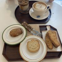 Madeleine,  cookie, and free cookies. With an iced and a hot latte    at Bgomi in Seoul