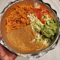 Sides: vegan Spanish rice, beans, lettuce, tomatoes, and guacamole at Poco Loco in Toledo