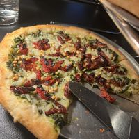 Pesto pizza made vegan w vegan pesto and daiya   at Renee's Organic Oven in Tucson