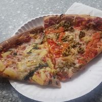 Bought by the slice $3.50 each. Vegan pineapple pesto on the left and vegan mediterranean on the right. SO good! at The Joint Pizzeria in Victoria