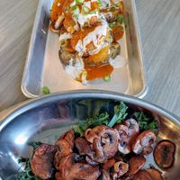 Potato slices with chicken nuggets and a side of mushrooms and kale at Florish in Tampa