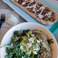 Sun Goddess bowl with custom sausage cashew cream pizza at Florish in Tampa