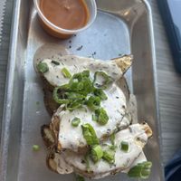 Loaded wedges with sauce on the side   at Florish in Tampa