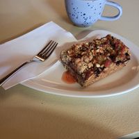 Vegan gluten-free crumble and cappuccino with oat drink at Freddy's Cafe in Kolding