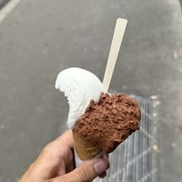 Dark chocolate 100% and Limone ice cream in vegan cone  at Artico Gelateria in Milan