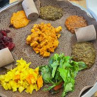 Combo with a tofu dish in the middle  at Abol Africa in Footscray