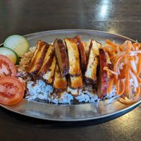 BBQ tofu served atop rice with a side of pickled daikon and carrots, and fresh cucumber+tomato. at Heart and Soy in Louisville