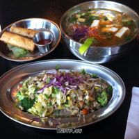 spicy noodle soup with vegan fried rice and spring rolls at Heart and Soy in Louisville