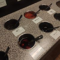 Sauce station options at One Plus in Manchester