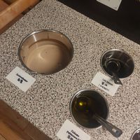 Sauce station options at One Plus in Manchester