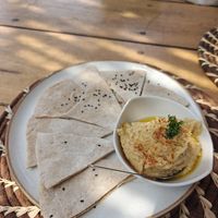 Hummus with pita bread at Dos Aguas Lodge in Rincon Del Mar