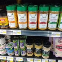 Nutritional yeast, vegan parmesan, and canned coconut products at Ada's Natural Market & Cafe in Fort Myers